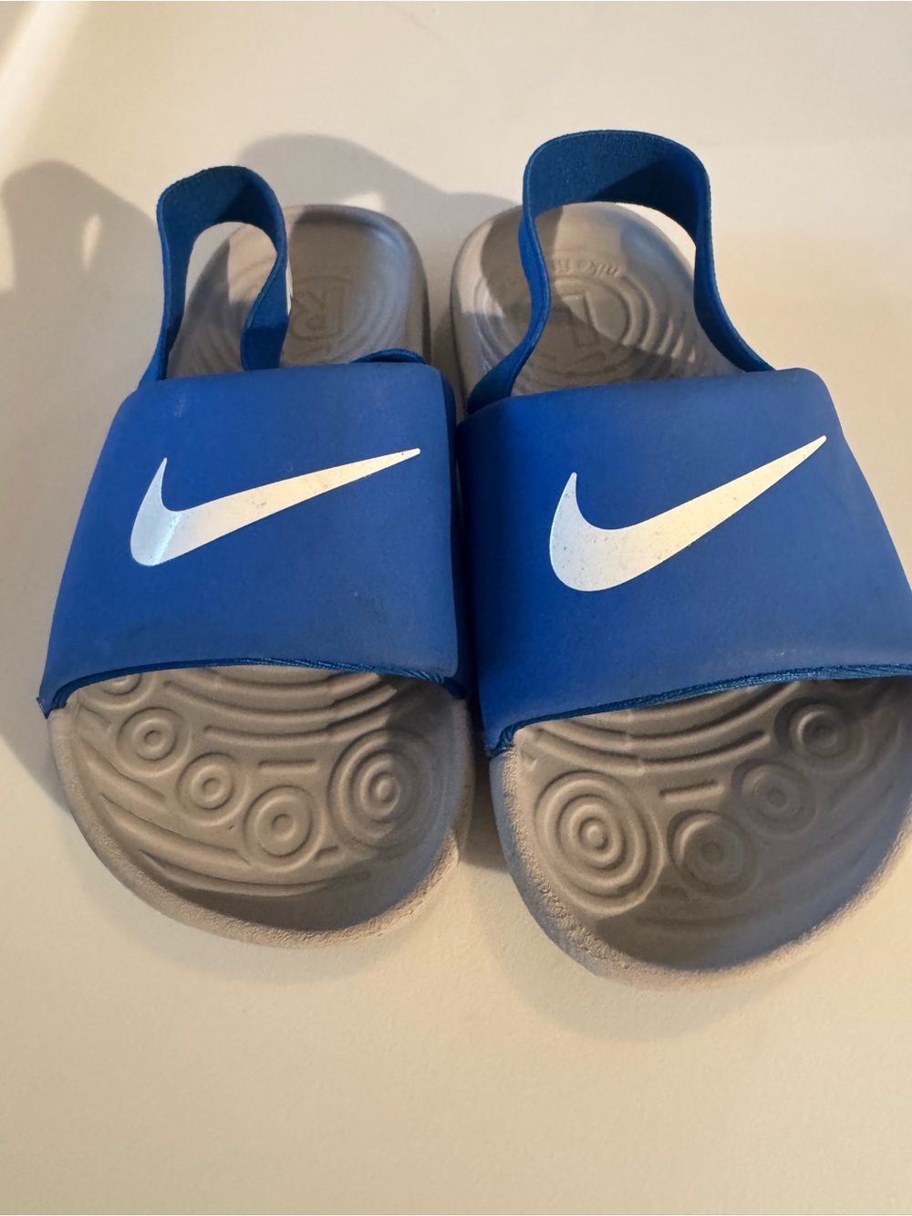 Nike Kids Blue Slides with White Swoosh and Gray grateful pool or beach sleep on